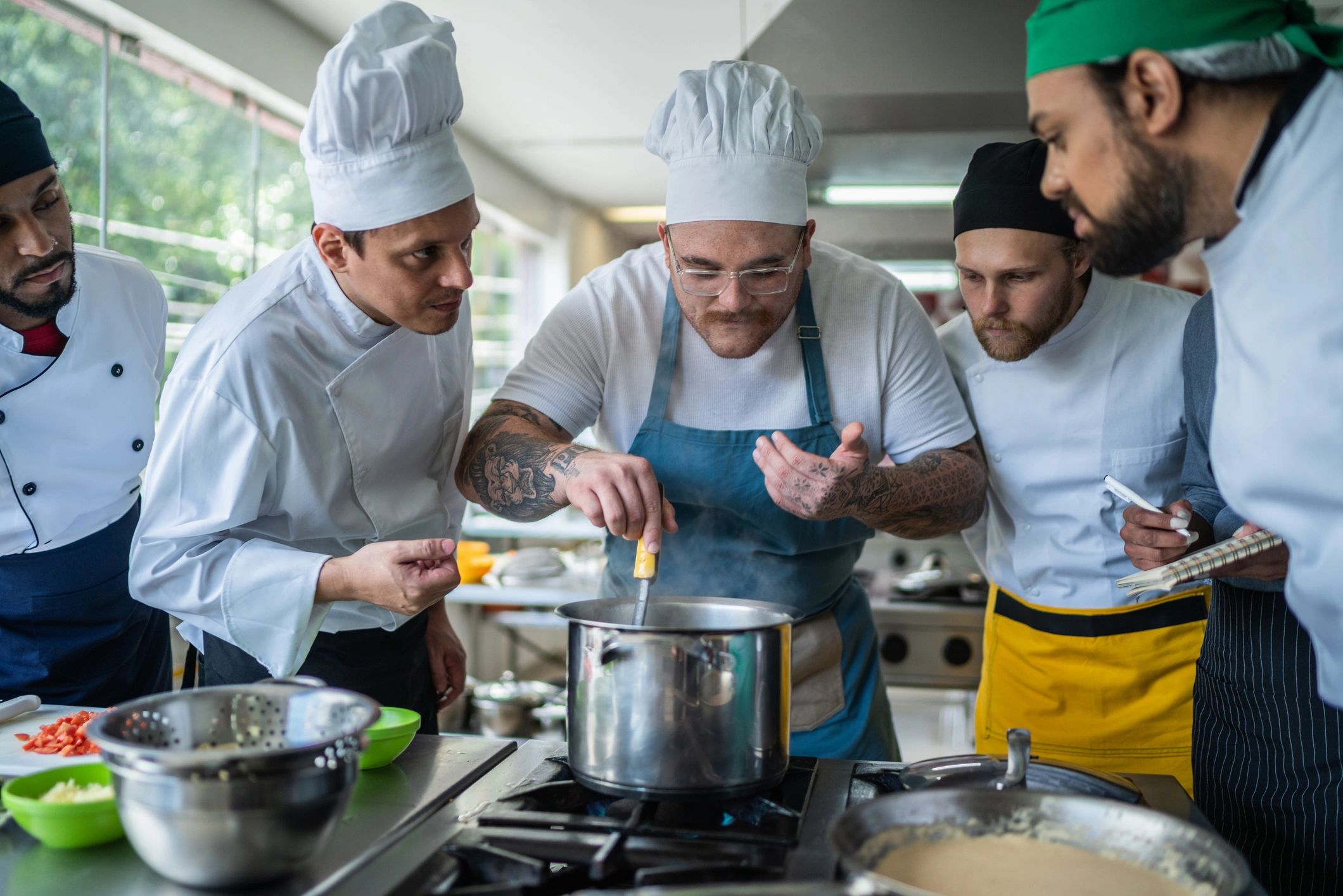 Team members preparing food together in a kitchen