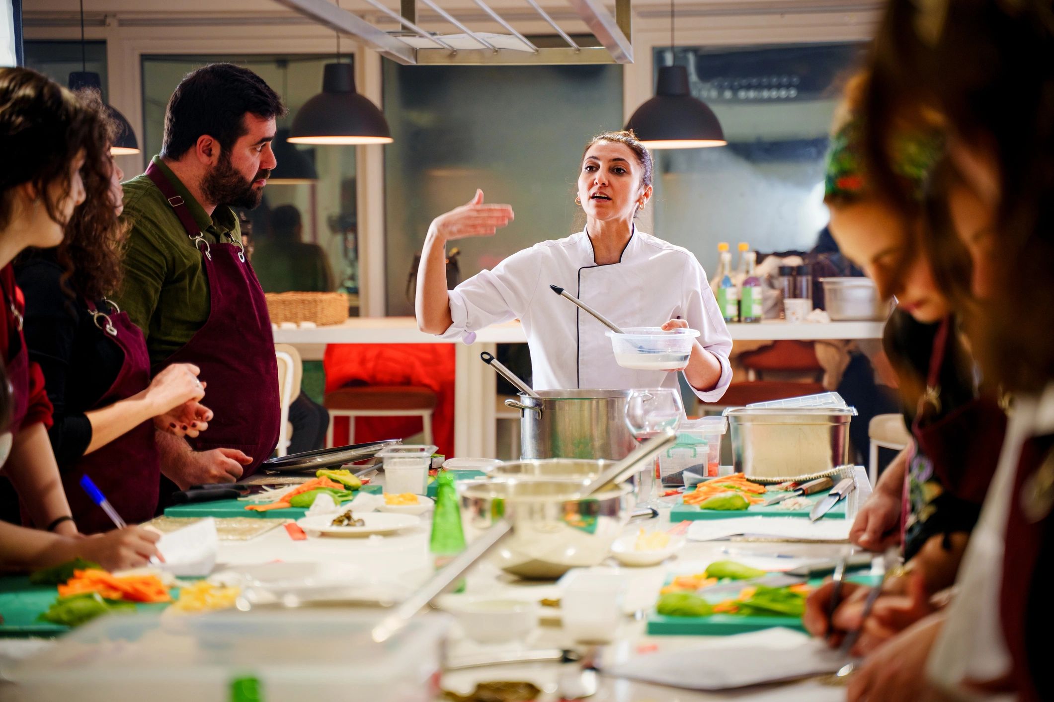 Kitchen team collaborating in a modern cooking workspace