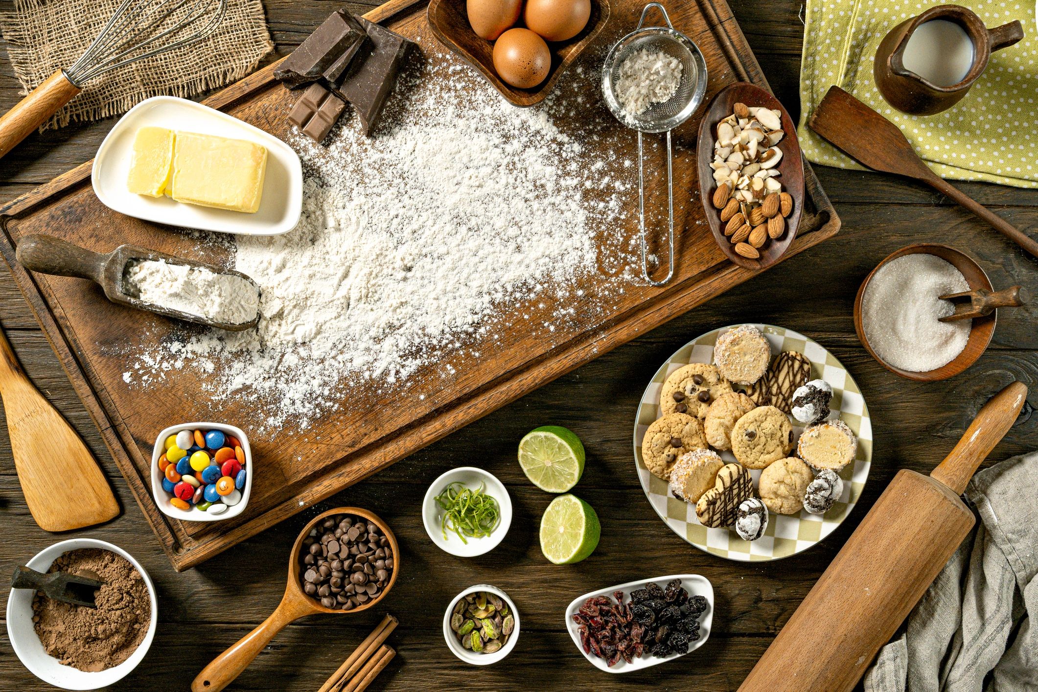 Kitchen ingredients and utensils arranged on a wooden table